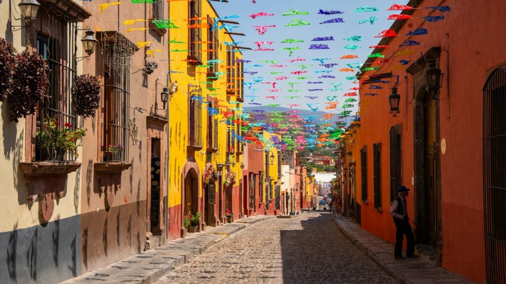 Cross-Border Prepaid Plans With Talk and Text in Mexico and Canada Colourful street in Mexico decorated with papel picado