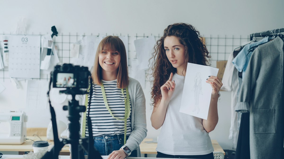 Two designers filming a video in a studio
