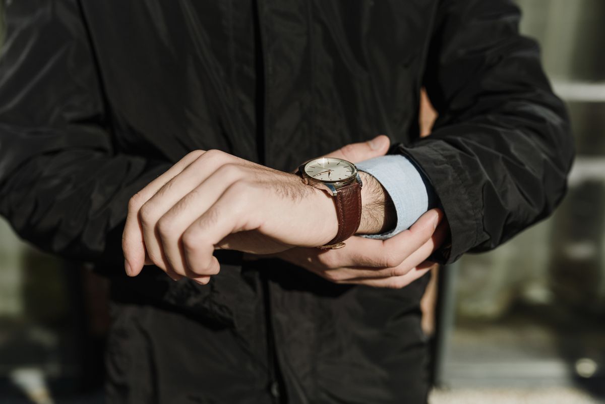 Man adjusting his wristwatch