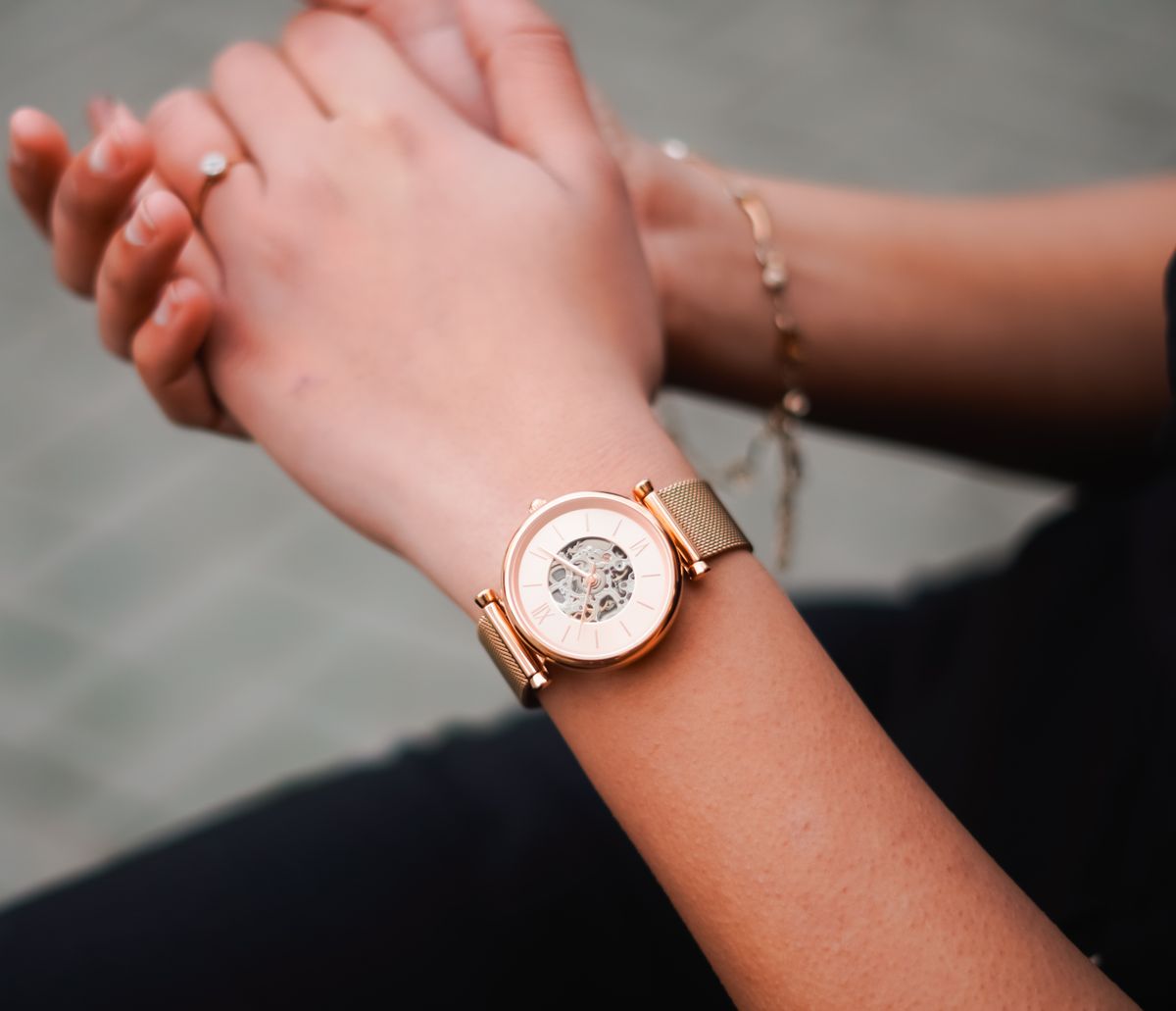 Rose gold watch on a woman's wrist